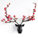 Sculpture murale décorative représentant un cerf