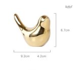 Figurine d'oiseau brillant doré