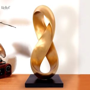 Sculpture abstraite dorée en résine 38 cm
