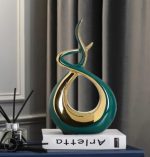 Sculpture minimaliste en or brillant