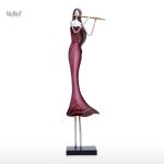 Sculpture artistique de musicienne en métal