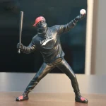 Sculpture artistique représentant un joueur de baseball