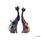Statue de couple de chats avec feu d'artifice