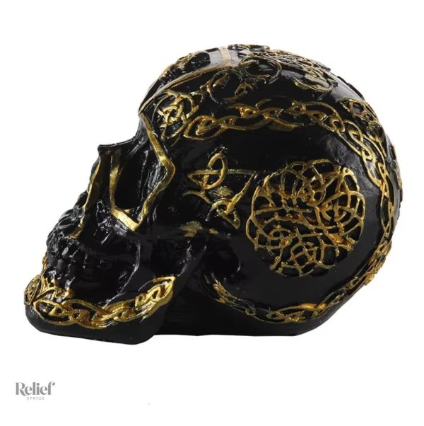 Objet décoratif crâne mexicain, finition noire et dorée 12 cm