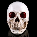 Déco crâne décoratif, yeux rouges éclatants, 19 cm