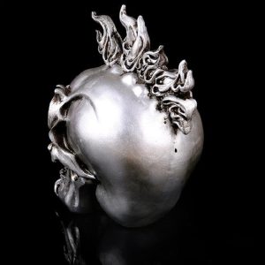 Objet de collection : statue crâne stylisée et audacieuse