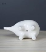 Éléphant décoratif en porcelaine avec pot