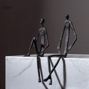 Statuette métal représentant un homme assis