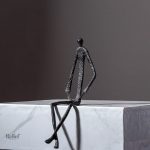Art en métal, figurine homme assis