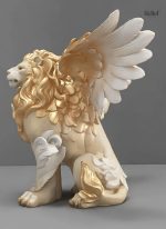 Ornement blanc et doré de lion ailé