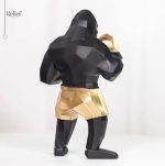 Gorille boxeur en décoration noire et dorée, 25 cm