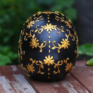 Crâne décoratif noir et doré, style mexicain, 14 cm