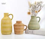 Vase antique en céramique verte de style grec