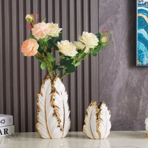 Vase décoratif en céramique avec motif de feuilles dorées